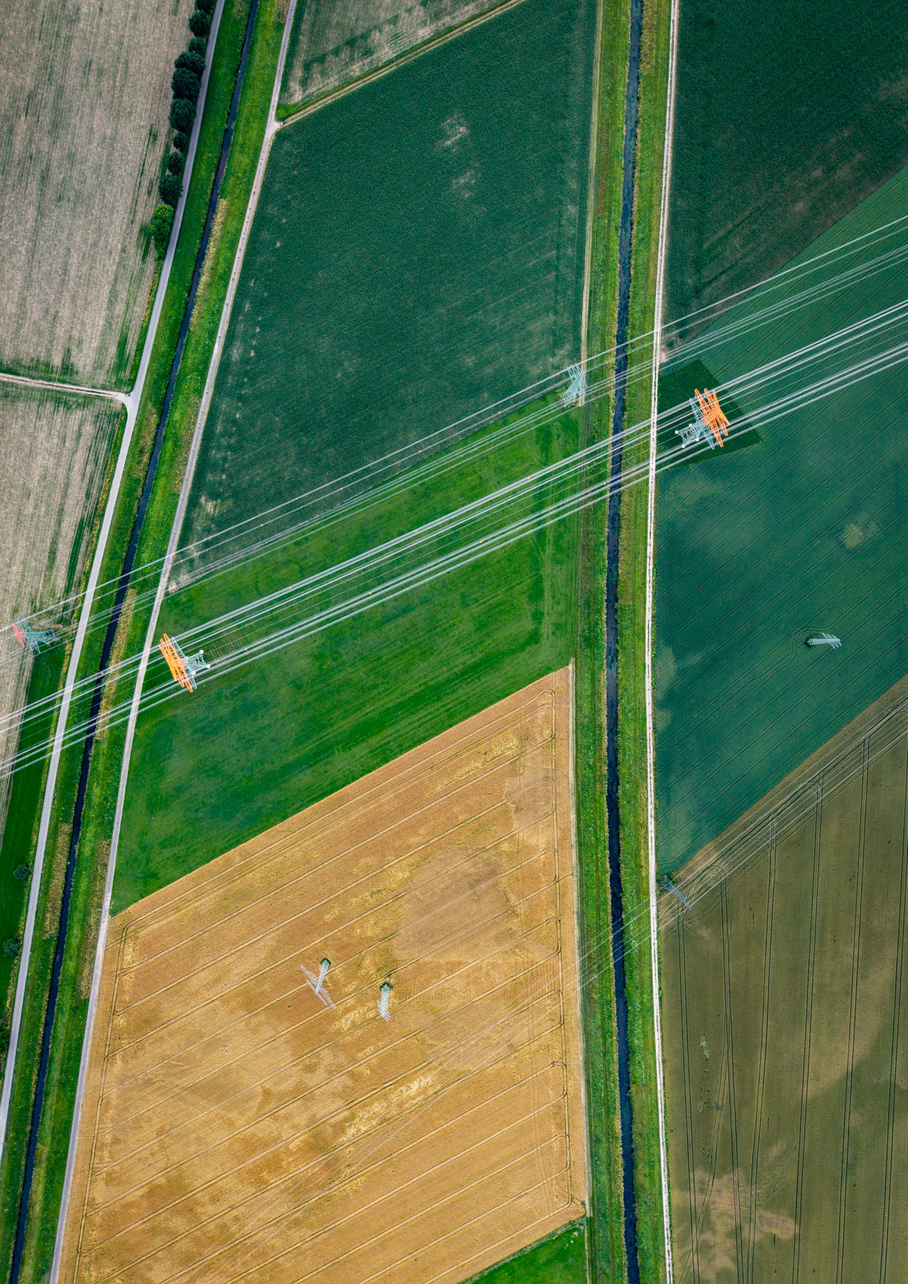 Aerial view of farmland divided into mapped, numbered blocks.